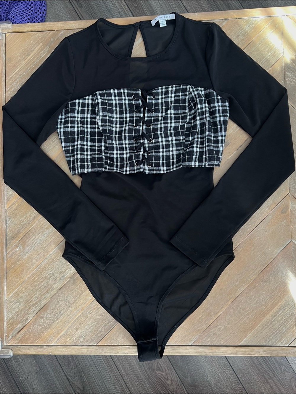 Black bodycon mesh long sleeve bodysuit with lace up plaid bust panel